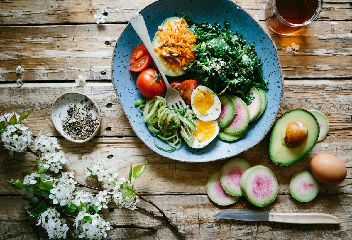Colorful healthy whole foods on a table — food as medicine and nutrition chiropractic wellness, Forest Hills Queens NY