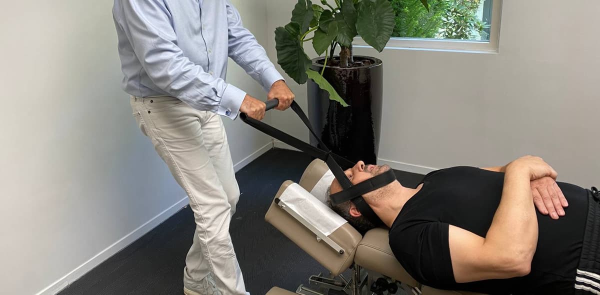 Y-Strap Ring Dinger spinal decompression adjustment performed by a chiropractor, Nektalov Chiropractic Forest Hills Queens NY