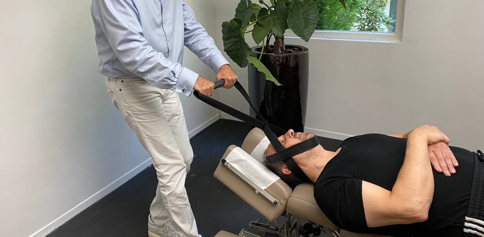 Y-Strap Ring Dinger spinal decompression adjustment performed by a chiropractor, Nektalov Chiropractic Forest Hills Queens NY