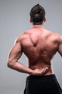 Back pain injury on fit adult man